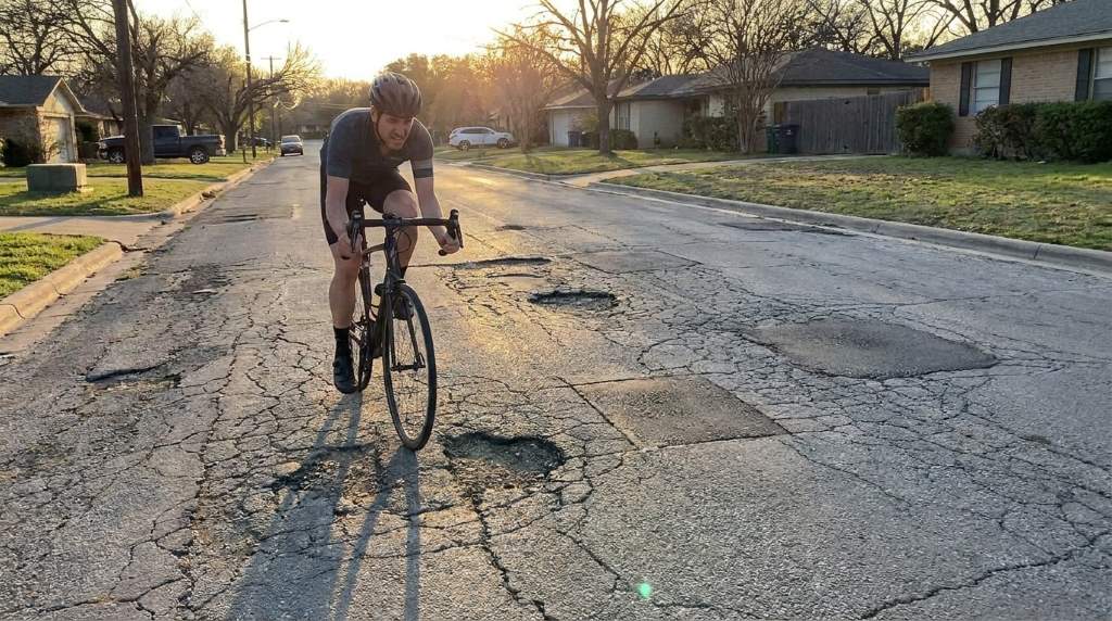 Cyclist checking saddle and handlebar position before riding